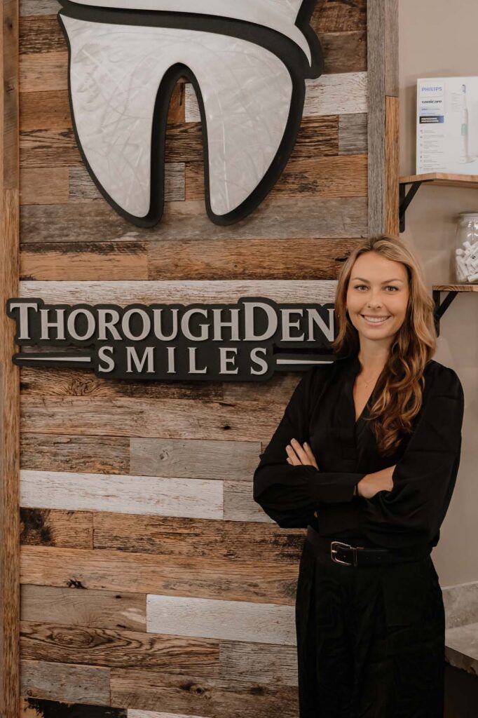 image of Dr. Sellman standing beside the logo of thoroughdent smiles