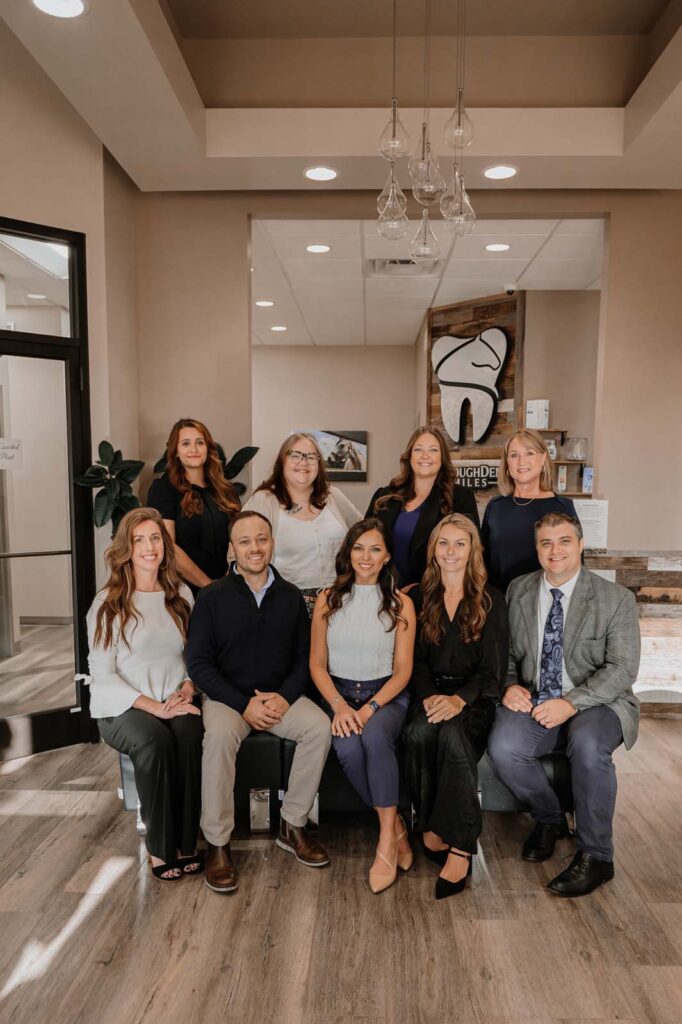 group photo of employees in office lobby