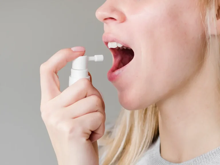 woman using mouth spray